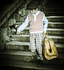 Image showing Exterior stairs and child with vintage bag