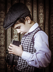 Image showing Child taking pictures with vintage camera