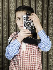 Image showing Child taking pictures with vintage camera