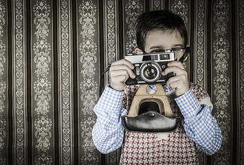 Image showing Child taking pictures with vintage camera