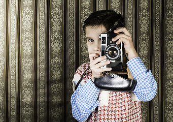 Image showing Child taking pictures with vintage camera