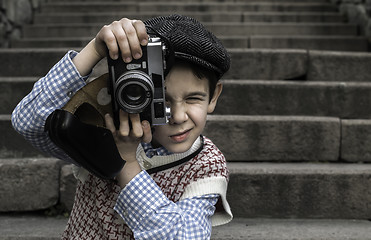 Image showing Child with vintage camera