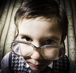 Image showing Smiling child with glasses in vintage clothes