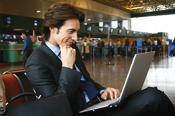 Image showing working on laptop at airport