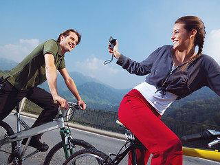 Image showing couple on bicycles in the park