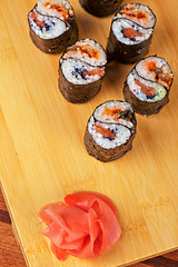 Image showing sushi rolls with tobico and pancake