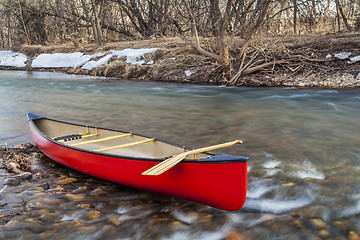 Image showing red canoe on a river