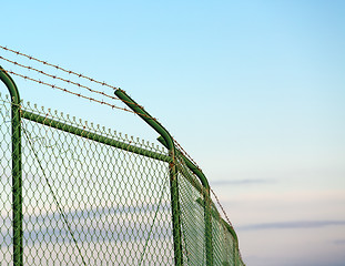 Image showing Mesh fence with barbed wire