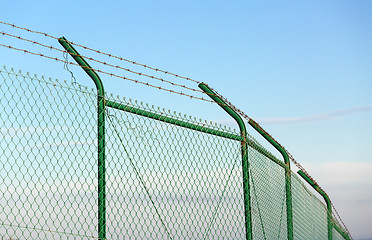 Image showing Mesh fence with barbed wire