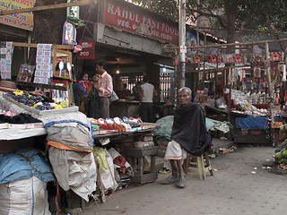 Image showing Streets of Kolkata. A street vendor offers his goods