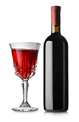 Image showing Glass of red wine and bottle