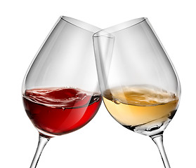 Image showing Moving wine in two wineglasses