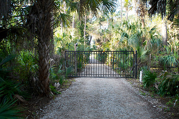 Image showing closed gate on dirt road