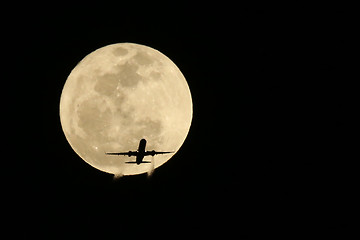 Image showing Jet Airplane Passing in front of a Full Moon- Real not Digitally