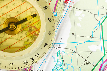 Image showing old touristic compass on map