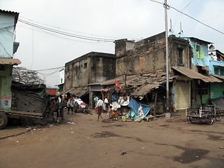 Image showing Streets of Kolkata. Poor Indian family living in a makeshift shack by the side of the road