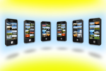 Image showing Modern mobile phones with different images