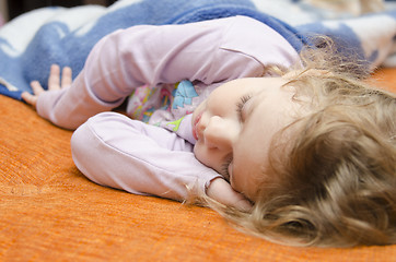 Image showing Girl sleeping on the couch