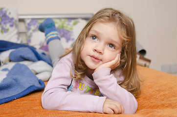 Image showing Girl enthusiastically watching TV