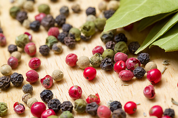 Image showing Dry bay laurel leaf with multicolored peppercorn