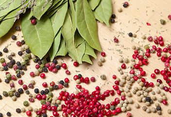 Image showing Dry bay laurel leaf with multicolored peppercorn