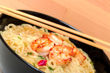 Image showing Shrimp and noodle soup bowl with chopsticks