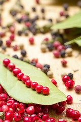 Image showing Dry bay laurel leaf with multicolored peppercorn