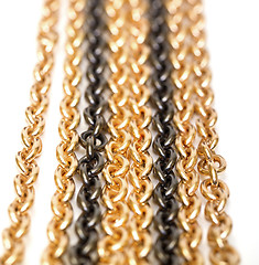 Image showing Golden and black chains