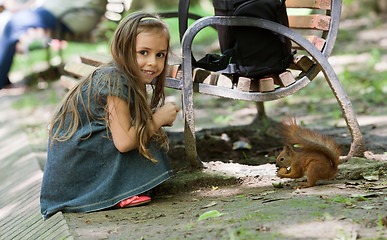 Image showing Little girl with squirrel
