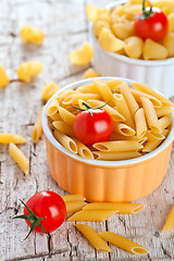 Image showing uncooked pasta and cherry tomatoes