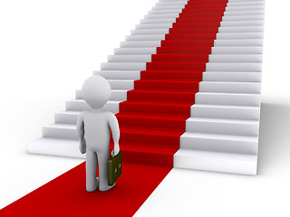 Image showing Businessman in front of stairs with red carpet