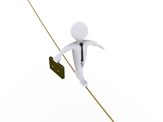 Image showing Businessman is walking on tightrope