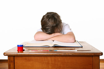 Image showing School child with head in hands