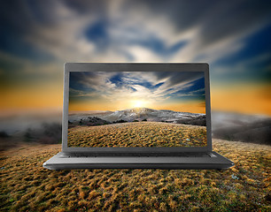 Image showing Mountains on a display of notebook