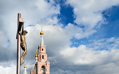 Image showing Statue of the crucifixion and church.