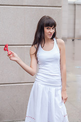 Image showing Pretty girl with red beads