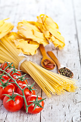 Image showing uncooked pasta with tomatoes and spices