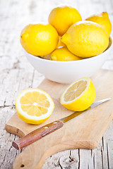 Image showing fresh lemons in a bowl and knife