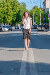 Image showing businesswoman walking on the road