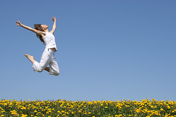 Image showing Young woman in a beautiful jump