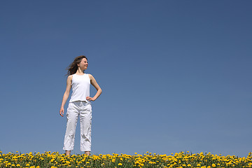 Image showing Young woman in flowering field