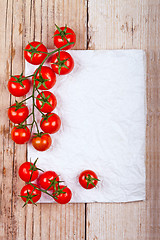 Image showing fresh cherry tomatoes and piece of paper