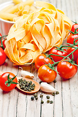 Image showing uncooked pasta with tomatoes and spices