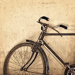 Image showing Old rusty bicycle on grunge wall background