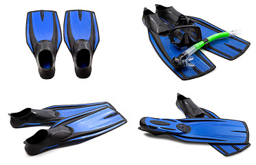 Image showing Set of blue swim fins, mask, snorkel for diving with water drops