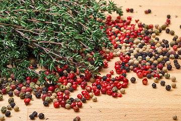 Image showing Dry thyme with multicolored peppercorn