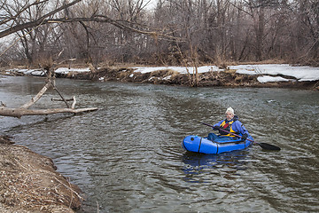 Image showing paddling a packraft on a river