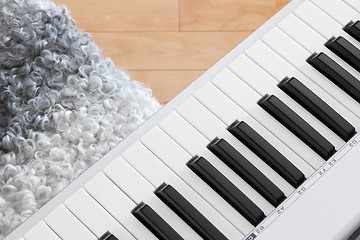 Image showing Close-up of electric piano and chair