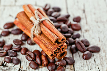 Image showing stack of cinnamon sticks and coffee beans 