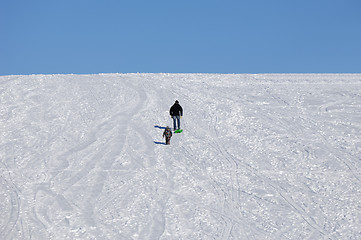 Image showing People walking up hill at winter